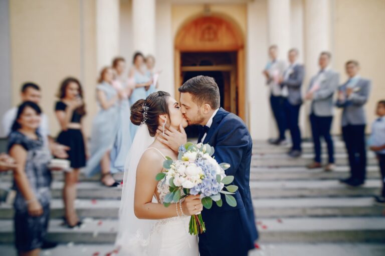 young-beautiful-bride-is-standing-near-house-with-her-husband